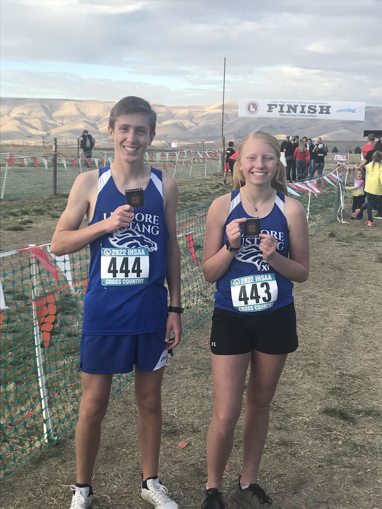 Azelynn, Raymond with their medals XC state